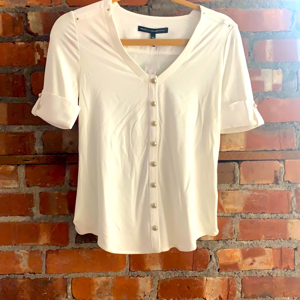 WHBM - White blouse with gold accents on the short sleeves and gold buttons.